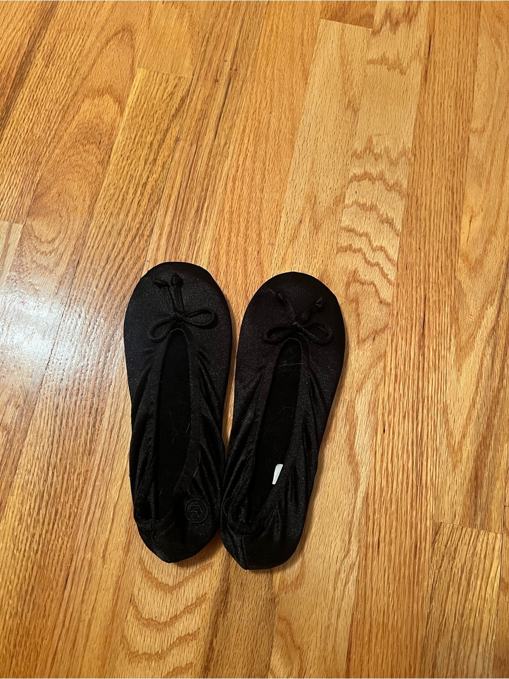 isotoner Black Ballet Flats with Bow Accent